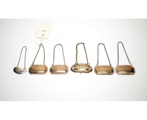 Four matching silver decanter labels, by Francis Howard Ltd; and two others. 