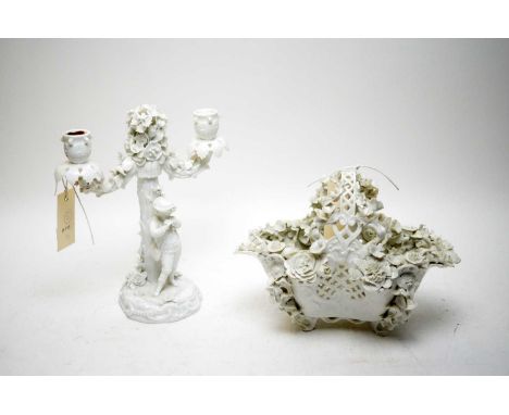 A Meissen blanc de chine twin-branch candelabra, formed as a boy by a floral encrusted tree, 25cms high; together with a Meis