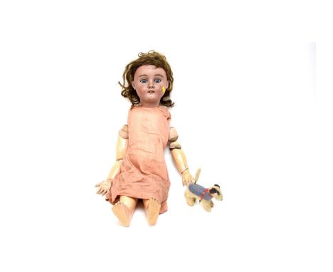 A German bisque headed doll, by Max Handwerck; together with a vintage teddy toy, with wind-up wagging tail.  