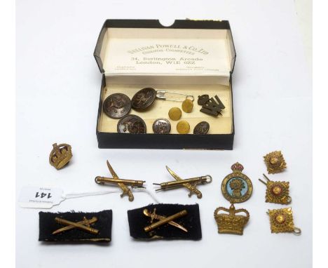 A selection of Military buttons and badges, including The Woman's Land Army.