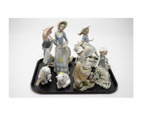 A selection of Lladro figures, including: pair of Lladro polar bears; Lladro geisha girl figure; Lladro figure of a lady with