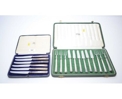 A plated and steel six place fruit knife and fork set, cased retailed by Harrods; a silver handled set of tea knives, cased. 