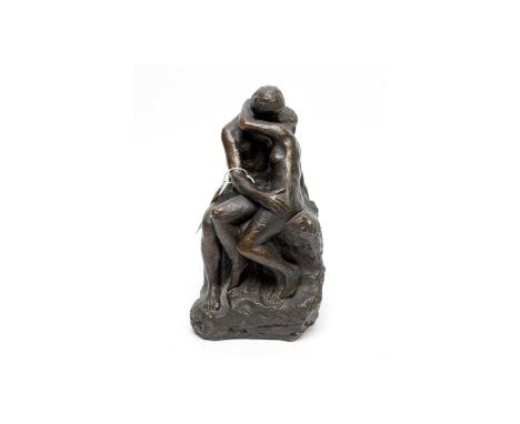 A contemporary bronzed sculpture, formed as a figure group of a couple embracing, signed Austin Prod Inc, 26cms high.