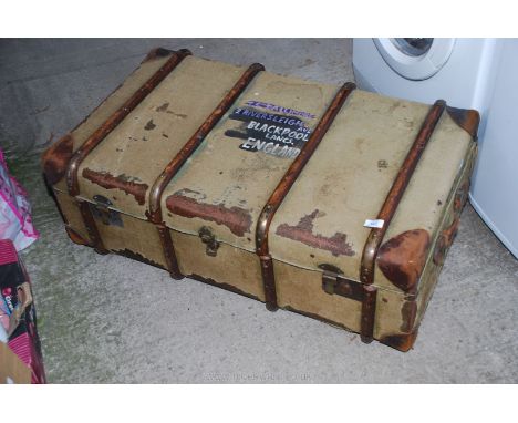 A canvas and bentwood bound travel trunk by Standex.