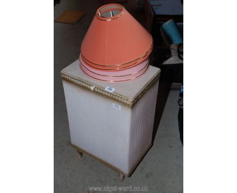 Lloyd Loom style laundry basket and lamp shades.