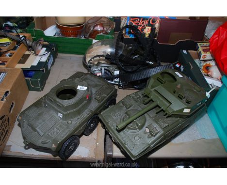 Two plastic army tanks, a helicopter and motorbike