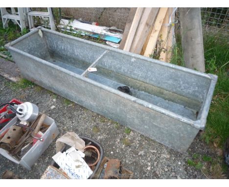A galvanised water trough.
