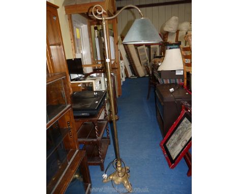 A Brass standard lamp in street light style with green shade.