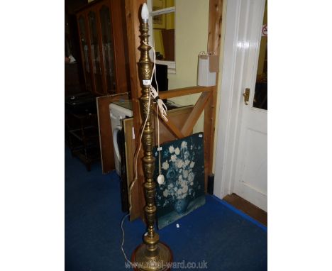 A brass standard lamp.