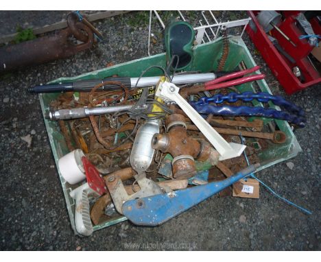 A plastic tray, mixed contents to include hand-brake lever, extension pole, tape gun, hammers, wood augers, torque wrench, le