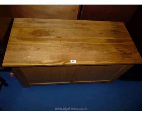 A light oak effect blanket box and contents, 39 1/2" wide x 18" deep x 19 1/2" high.