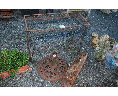 Animal tethering bracket, metal side table (top missing) and metal parasol holder.