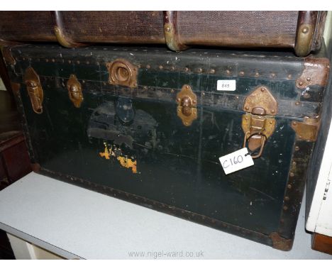 A wooden steamer trunk. 36" L x 20" D x 181/2" H.