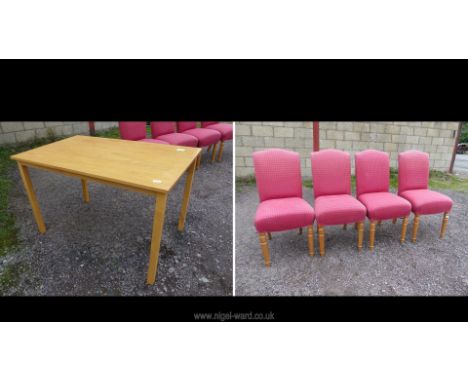 A light oak finish table and four chairs in pink upholstery 47" L x 29 3/4" W x 29" H