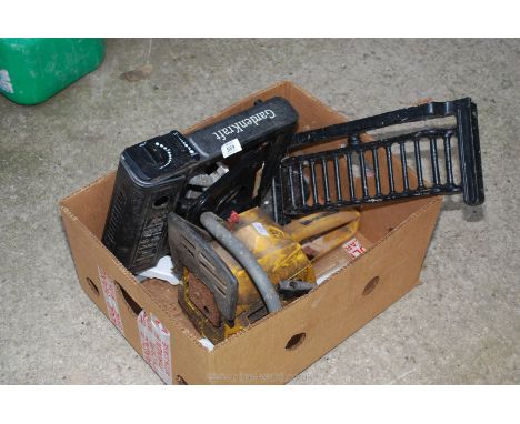 A gas camping stove, fire front and a part chainsaw.