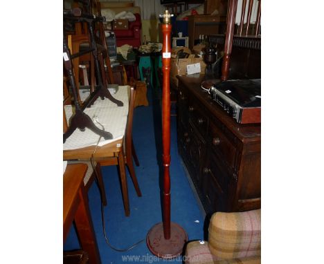 A wooden standard lamp, no shade.