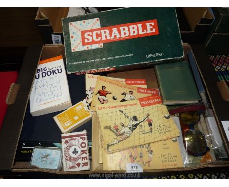 A box of games, books, playing cards etc