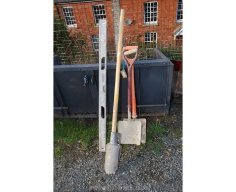 Two shovels, a post hole spade a/f. and a builders' level.