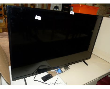 A Polaroid 40 " flat screen smart TV with remote