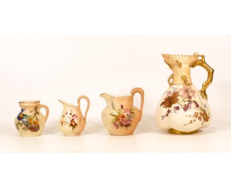 Three Royal Worcester Blush Ivory Jugs to include one with arboral style gilt handle and ornamentation together with two mini