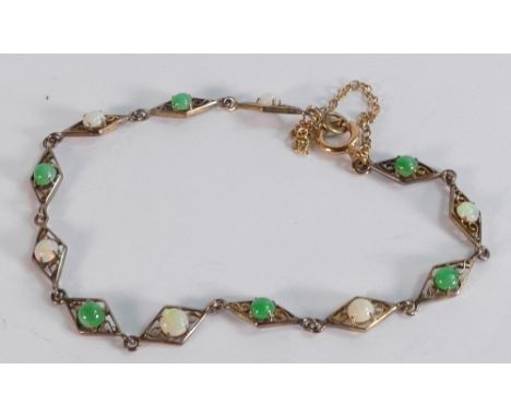 9ct gold bracelet set with jade and opal stones, 3.9g. 