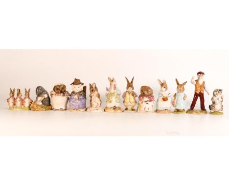 A collection of Beswick &amp; Royal Albert Beatrix Potter figures to include - Mrs Rabbit Cooking (6a) Mrs Tiggy Winkle Takes