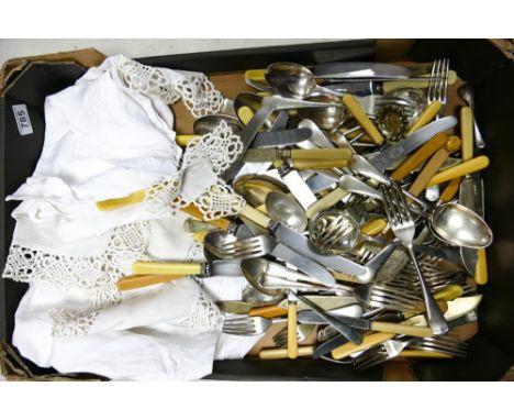 A large collection of Silver plated cutlery and some vintage linen. 