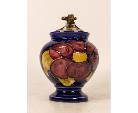 Moorcroft Clematis on blue lighter . Height 12cm. Boxed 