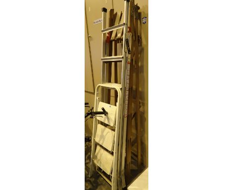 Two pairs of aluminium step ladders and a wooden pair