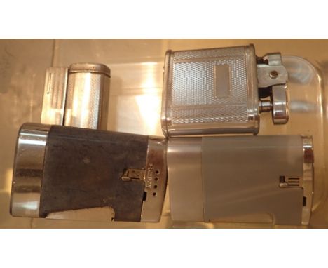 Box of four vintage lighters