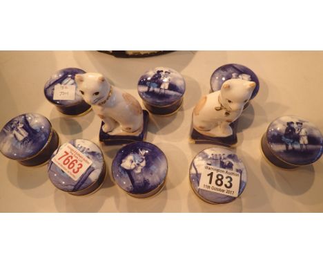 Eight lidded pots and a pair of ceramic cats