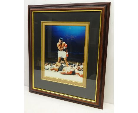 Photographic print of Muhammad Ali vs. Sonny Liston, possibly signed by Muhammad, in mounted framed display, H35cm x W28cm   