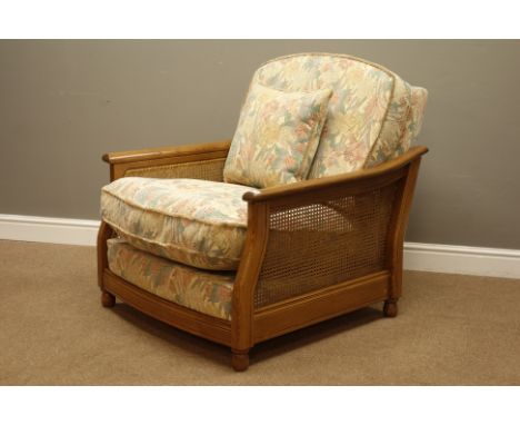 Ercol golden dawn elm bergere armchair upholstered loose cushions in floral fabric, W90cm, D100cm   Condition Report   Click 