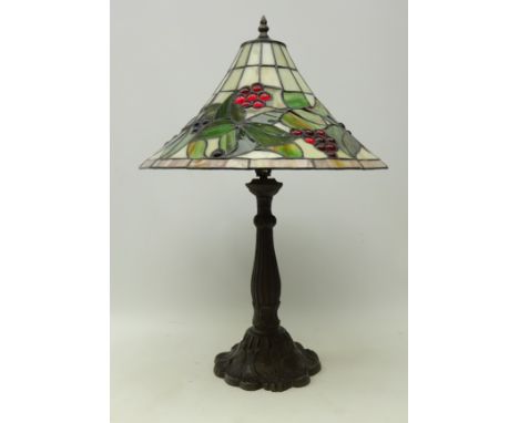 Tiffany style table lamp with leaded glass shade decorated with berries, H65cm    Condition Report   Click here for further i