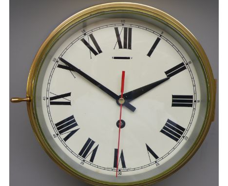 20th century brass cased bulkhead Ship's Clock, circular Roman dial with centre sweep seconds, bevelled glass cover in hinged