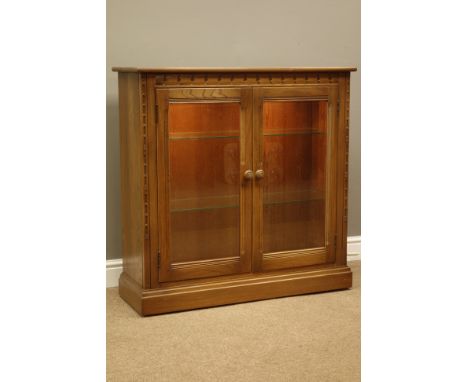 Ercol golden dawn finish illuminated bookcase/display cabinet, two bevel glass glazed doors, W97cm, H96cm, D34cm   Condition 