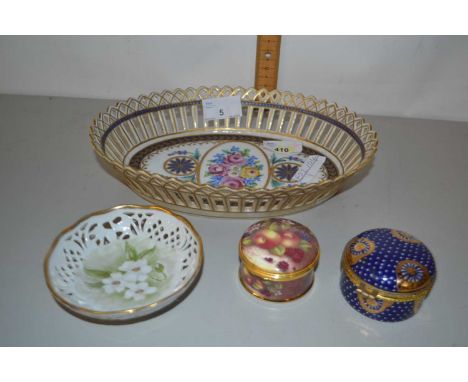 A group of porcelain wares and a pill box painted with fruits, the interior with quartz clock, further blue ground pill box, 