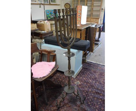 Brass Jewish Menorah seven branch floor standing candlestick on tripod base, 142cm high