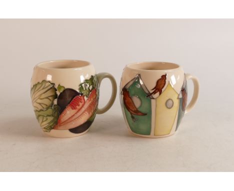 Two Moorcroft barrel mugs to include Vegetable patch and Bird houses and birds (2) 