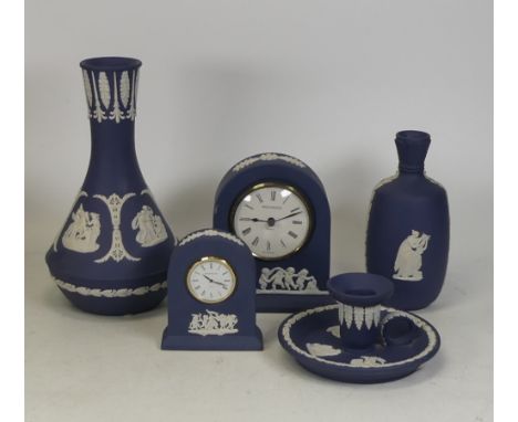 Wedgwood Jasperware Royal Blue items to include 2 vases, 2 mantle clocks and a candlestick holder. Height of tallest 19.5cm (