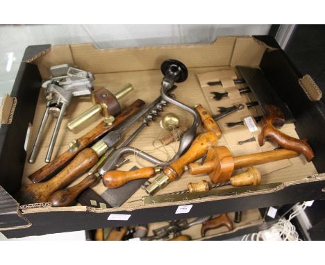 A good collection of early woodworking tools to include a brace and a collection of bits.