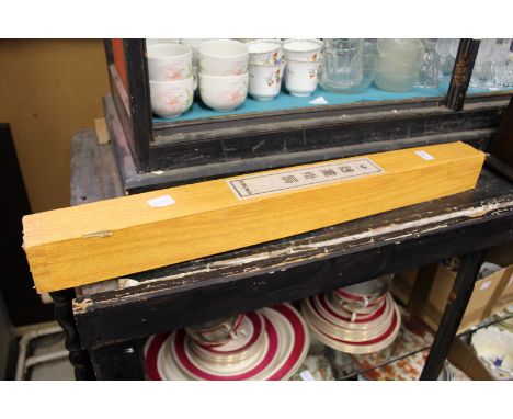A Chinese scroll, boxed.