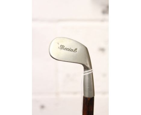 A golf putter walking stick.