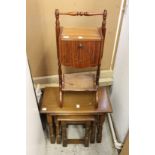 A nest of oak tables and a sewing box.