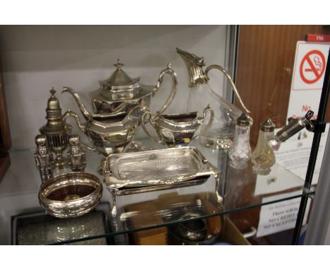 A plated three piece tea service, claret jug and other items.