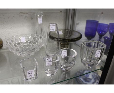 A small group group of Orrefors glassware to include small vases with engraved decoration.