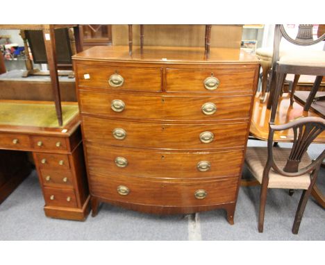 A good 19th century mahogany bow front chest of two short and four graduated long drawers on splay bracket feet.