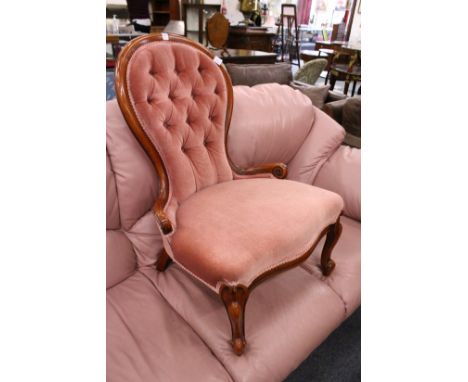 A button backed bedroom chair.