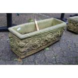 A composite rectangular garden planter.