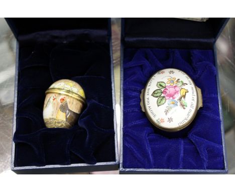A Halycon Days enamel egg shaped box and an oval box.